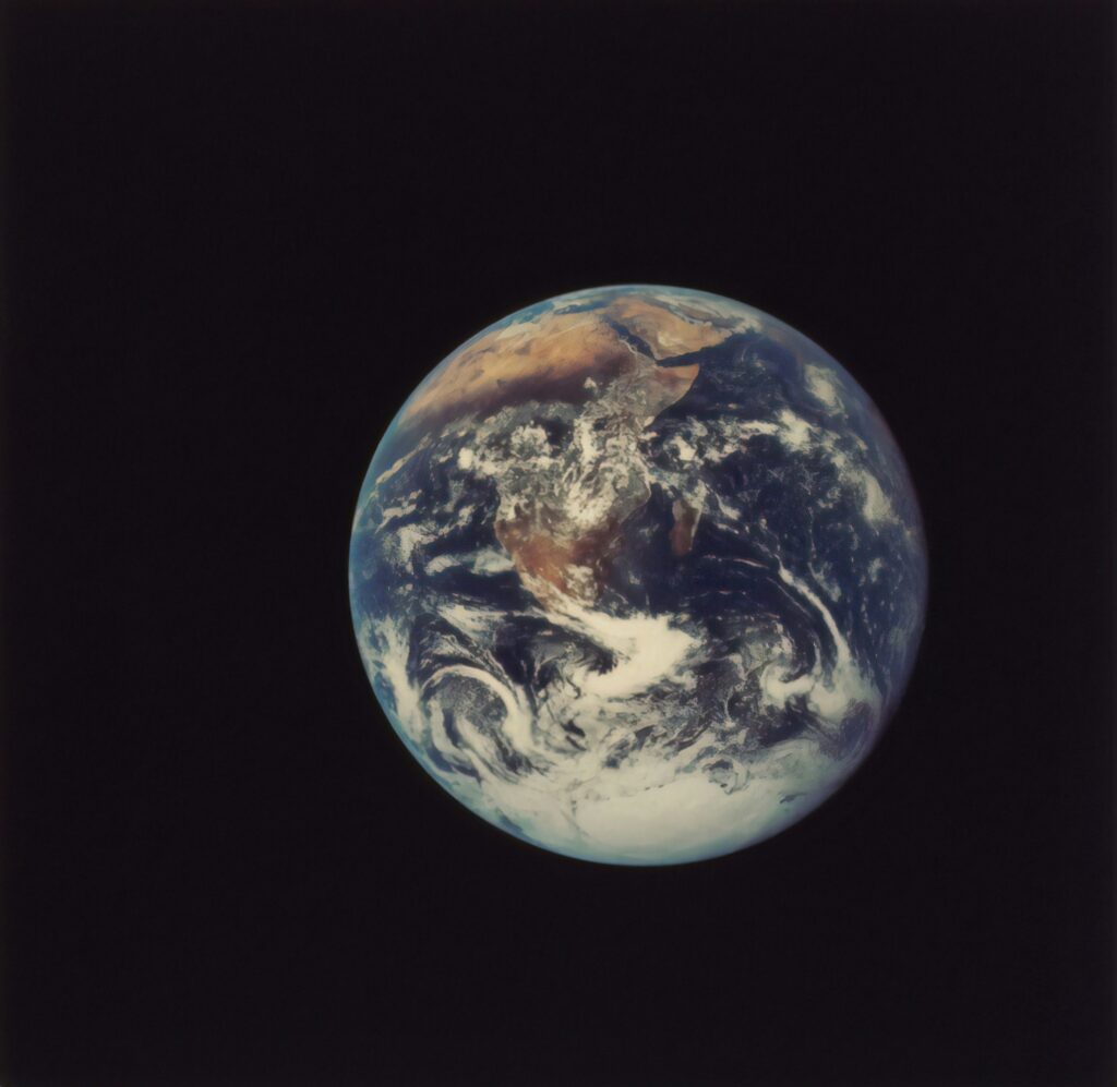 Earth photographed from Apollo 17, a small blue sphere in vast blackness